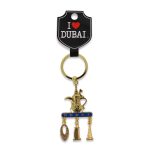 Gold-toned keychain featuring an Arabic Dallah coffee pot and hanging charms of the Burj Khalifa, Burj Al Arab, and Museum of the Future