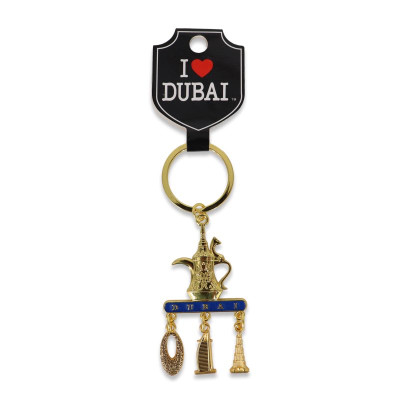 Gold-toned keychain featuring an Arabic Dallah coffee pot and hanging charms of the Burj Khalifa, Burj Al Arab, and Museum of the Future