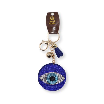 Round blue crystal-encrusted Evil Eye keychain with gold-tone hardware and a blue fabric tassel.