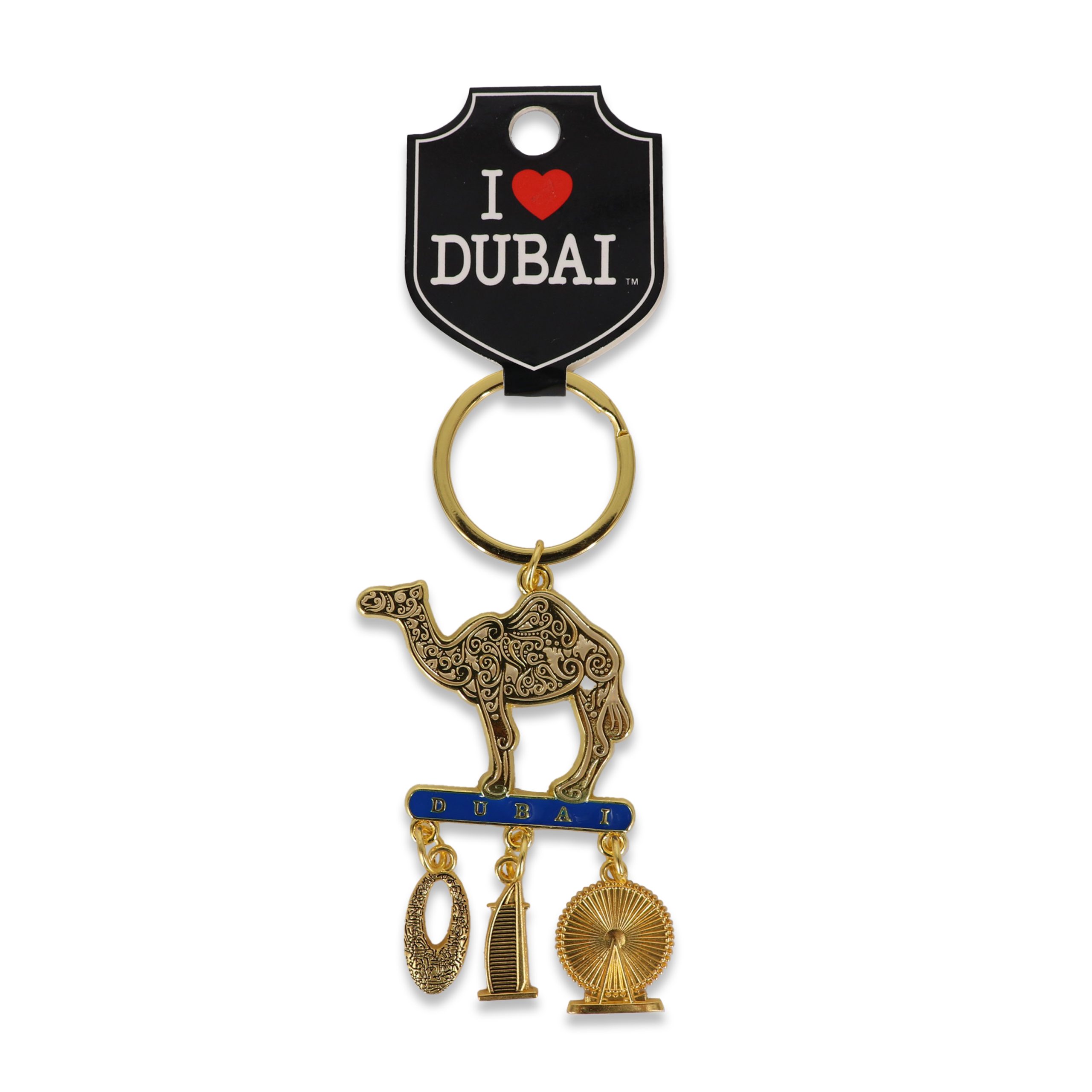 Camel Souvenir Keychain with Iconic Landmark Charms Gold-tone Dubai souvenir keychain featuring an intricately patterned filigree camel standing on a blue "Dubai" bar with dangling charms of the Burj Al Arab and Ain Dubai ferris wheel.