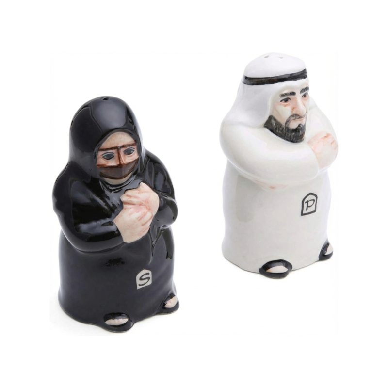 Ceramic salt and pepper shakers shaped like a traditional Arab couple; the male shaker is in a white Kandura and the female shaker is in a black Abaya.