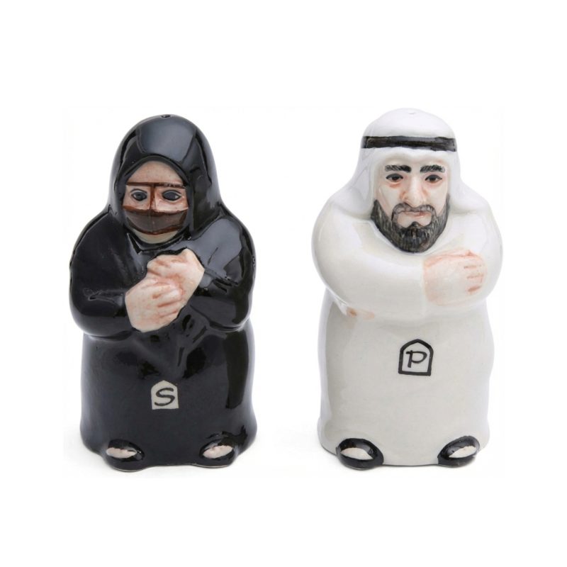 Ceramic salt and pepper shakers shaped like a traditional Arab couple; the male shaker is in a white Kandura and the female shaker is in a black Abaya.