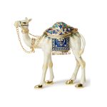 White and gold enameled camel figurine with blue crystal saddle and gold-tone chain bridle, featuring a magnetic opening for jewelry storage.