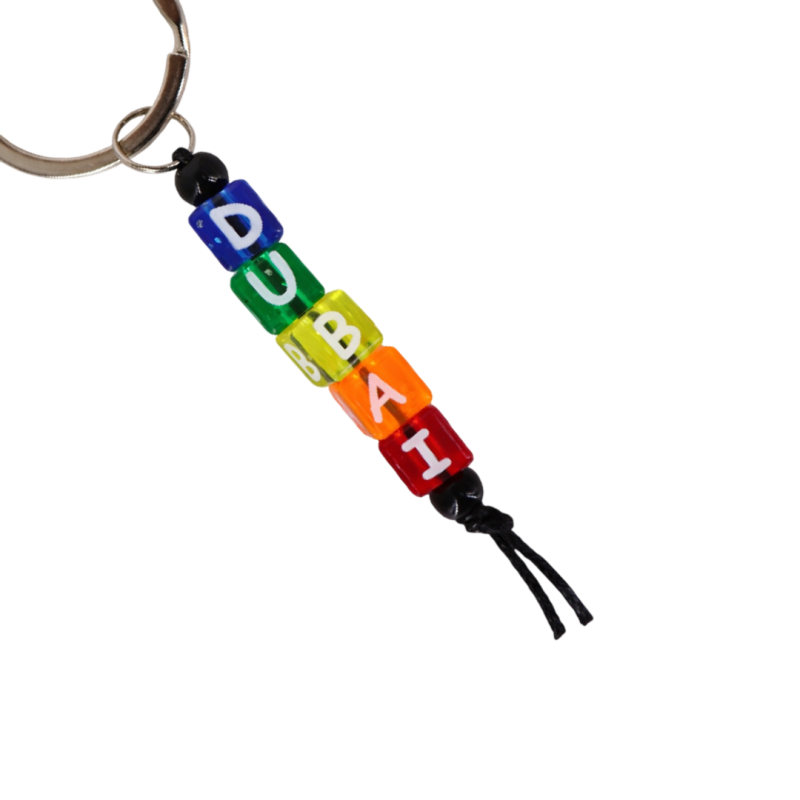 Colorful handmade Dubai letter bead keychain with metal ring and multicolor beads spelling DUBAI